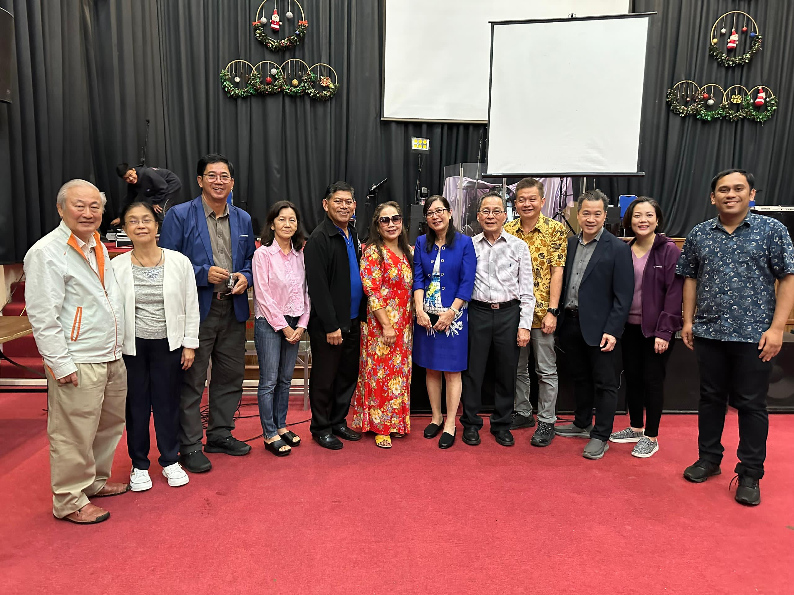 MYICCC community standing together at a gathering